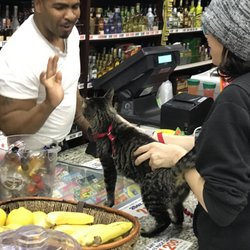 Canyon Market - Cat giving high fives. Cat also bought lots of Tequila.