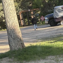 The owner's mother walking away from us after having verbally assaulted us simply because we started our car. The owner's mother walking away from us after having verbally assaulted us simply because we started our car.