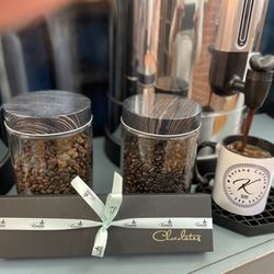 Kevana Dark and Medium Roasted Coffee Beans. Brewed medium roast coffee and Boxed Chocolate