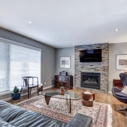 Artisan Kitchens & Renovations - We only had to replace the fireplace facing to give it a "Re-Fresh"