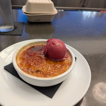 Reflections at Glasshouse - Creme brulee with raspberry sorbet - Salad Near Me - Golden Oak, Florida Reflections at Glasshouse - Creme brulee with raspberry sorbet - Salad Near Me - Golden Oak, Florida