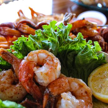 Shaggy's on the Rez - 5 bacon-wrapped, bourbon-glazed shrimp, 5 jasmine shrimp & 5 garlic-butter shrimp, served with fries & housemade hush puppies - American Near Me - Brandon, Mississippi