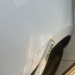 Dents Done Rite - Tesla Model 3 left rear quarter panel (before)
