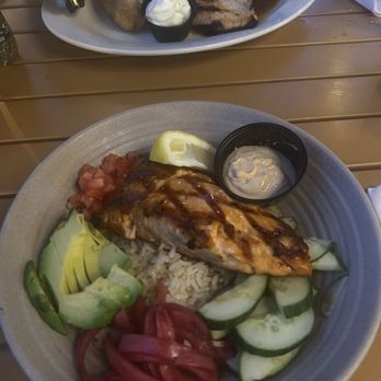 Tavern 265 - Salmon bowl in the front, pineapple chicken teriyaki with baked potato in the back - Sports Bars Near Me - Westerly, Rhode Island Tavern 265 - Salmon bowl in the front, pineapple chicken teriyaki with baked potato in the back - Sports Bars Near Me - Westerly, Rhode Island