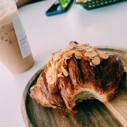 Almond croissant and iced latte Almond croissant and iced latte