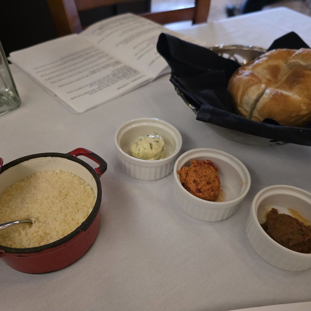 Casa Pollastro - Artisan Bread Service with herb, sundried tomato and eggplant butter. - Brazilian Near Me - Dallas, Texas Casa Pollastro - Artisan Bread Service with herb, sundried tomato and eggplant butter. - Brazilian Near Me - Dallas, Texas