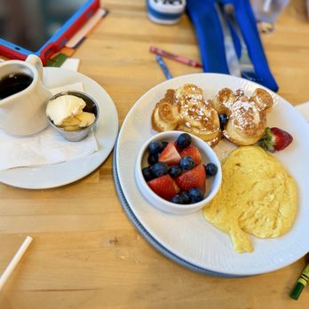 Olivia's Cafe - Kids Allergy-Friendly Mickey-shaped Waffles, Plant-Based Eggs, and Fresh Mixed Berries - New American Near Me - Lake Buena Vista, Florida Olivia's Cafe - Kids Allergy-Friendly Mickey-shaped Waffles, Plant-Based Eggs, and Fresh Mixed Berries - New American Near Me - Lake Buena Vista, Florida