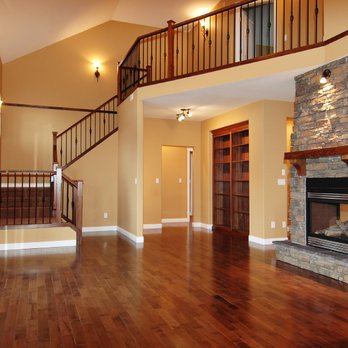 Lana Floor Covering - a living room with a stone fireplace - Flooring Near Me - Brisbane, California Lana Floor Covering - a living room with a stone fireplace - Flooring Near Me - Brisbane, California