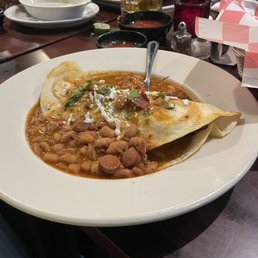 Charo Beans  over steak enchilada