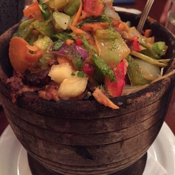 Salsa's - Slow braised pork w veggies curry sauce pineapple chutney kale deliciousness - Mexican Near Me - Asheville, North Carolina