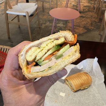 Hello Em Viet Coffee & Roastery - an-sang breakfast banh mi. their banh mi are pressed, and this breakfast version is filled with omelette, ham and bone marrow pate - Coffee Roasteries Near Me - Seattle, Washington Hello Em Viet Coffee & Roastery - an-sang breakfast banh mi. their banh mi are pressed, and this breakfast version is filled with omelette, ham and bone marrow pate - Coffee Roasteries Near Me - Seattle, Washington