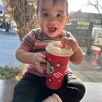 Starbucks - My Daughter with her free Red Cup, soaking up the sunshine while I sip on my daily caffeine - Coffee & Tea Near Me - North Vancouver, British Columbia Starbucks - My Daughter with her free Red Cup, soaking up the sunshine while I sip on my daily caffeine - Coffee & Tea Near Me - North Vancouver, British Columbia