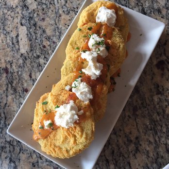 Lucille's - Fried green tomatoes - with a dollop of creamy goat cheese on top with an aioli drizzle, I could eat these every day - New American Near Me - Houston, Texas