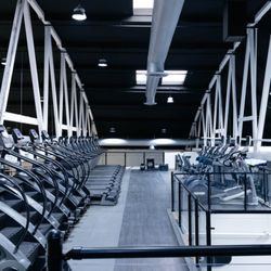 The BXNG Club - A full-second story cardio deck with an assortment of cardio machines including: treadmills, stair masters, ellipticals, and rowers.