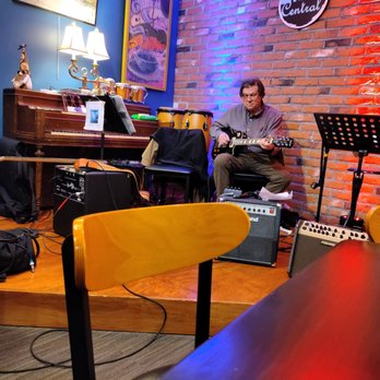 Java Central Cafe and Roaster - a man playing guitar - Coffee Roasteries Near Me - Westerville, Ohio Java Central Cafe and Roaster - a man playing guitar - Coffee Roasteries Near Me - Westerville, Ohio