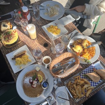 Sweet Maple - Our breakfast! souffle eggs, pancakes, panini sandwich, eggs benedict, and french toast (minus strawberries) - American Near Me - San Francisco, California