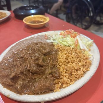 Enchiladas Y Mas - Carne guisada plate - Salad Near Me - Austin, Texas