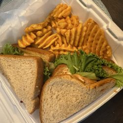 Stone Creek Grill - Turkey club on wheat and waffle fries