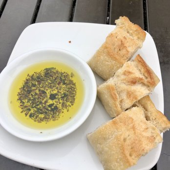 California Pizza Kitchen - Bread and olive oil with herbs - Pizza Near Me - Pasadena, California California Pizza Kitchen - Bread and olive oil with herbs - Pizza Near Me - Pasadena, California