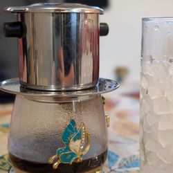 Family Cafe - Vietnamese ice coffee - strong, sweet and delicious! Came in a percolator at the table before for a fun DIY experience