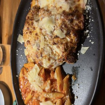 Capriccio - Chicken Parmigiana with penne pasta - Italian Near Me - Miami, Florida Capriccio - Chicken Parmigiana with penne pasta - Italian Near Me - Miami, Florida