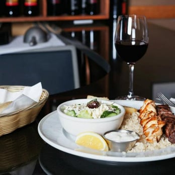 Kiki's Restaurant - a plate of food and a glass of wine - Mediterranean Near Me - Surrey, British Columbia