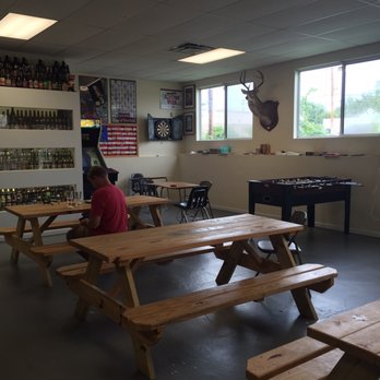 DogBerry Brewing - Layout.  Bar, picnic tables, darts, foosball, dead animals.  Casual. - Breweries Near Me - West Chester, Ohio