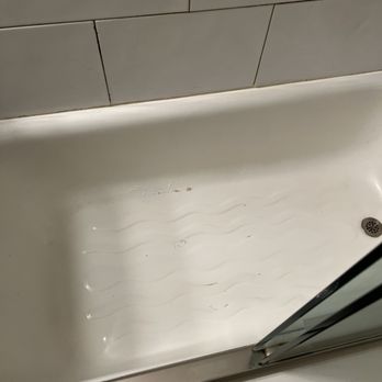 Caleb Reglazing - a bathtub with a glass door - General Contractors Near Me Caleb Reglazing - a bathtub with a glass door - General Contractors Near Me