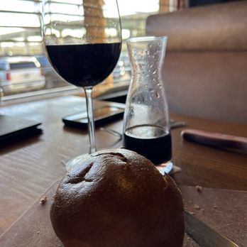 Saltgrass Steak House - a loaf of bread and a glass of wine - Steakhouses Near Me - Conroe, Texas Saltgrass Steak House - a loaf of bread and a glass of wine - Steakhouses Near Me - Conroe, Texas