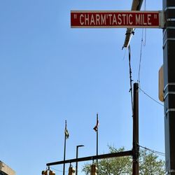 The Iconic "Charm'tastic Mile" Street Sign steps from G he Harborplace.