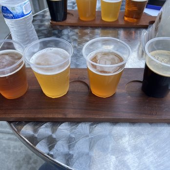 Atlantucky Brewing - Flight from left to right- Pale Ale, Belgian, IPA, Stout. - Beer Bar Near Me - Atlanta, Georgia Atlantucky Brewing - Flight from left to right- Pale Ale, Belgian, IPA, Stout. - Beer Bar Near Me - Atlanta, Georgia