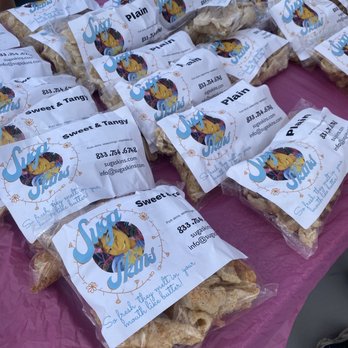 Bartlett Station Farmers Market - a table with bags of snacks - Farmers Market Near Me - Bartlett, Tennessee