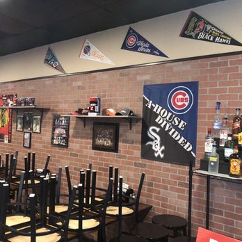 Windy City Pizza - a brick wall and chairs - Pizza Near Me - Virginia Beach, Virginia Windy City Pizza - a brick wall and chairs - Pizza Near Me - Virginia Beach, Virginia