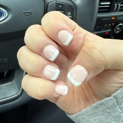 Kim's Nail Studio - Messy cuticles, sections of my natural nail not covered with SNS or polish, uneven French manicure lines, crooked tips, weird color base