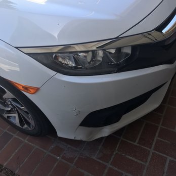 Dentway - Initial damage on the front left bumper. Dent and spot paint touch up needed - Body Shops Near Me - Los Angeles, California