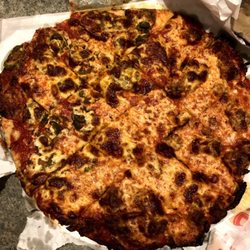 Obbie's Pizza - Half sausage half pepperoni & jalapeños. Ask for extra sauce and pizza cooked well done. SO GOOD