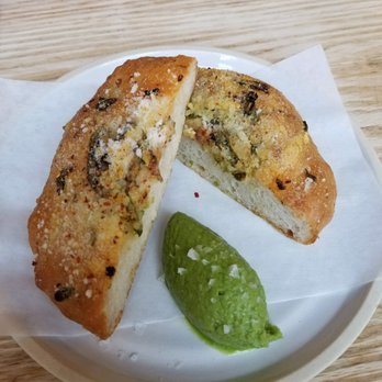 Lilia - Focaccia bread with garlic ramp butter - Italian Near Me - Brooklyn, New York Lilia - Focaccia bread with garlic ramp butter - Italian Near Me - Brooklyn, New York
