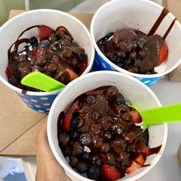 two bowls of chocolate covered strawberries