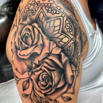 Sueno Tattoo - Two ornate roses with decorative mandala-like geometric patterns in the background, done in black and grey with strong contrast and detailed - Tattoo Near Me - Silver Spring, Maryland Sueno Tattoo - Two ornate roses with decorative mandala-like geometric patterns in the background, done in black and grey with strong contrast and detailed - Tattoo Near Me - Silver Spring, Maryland