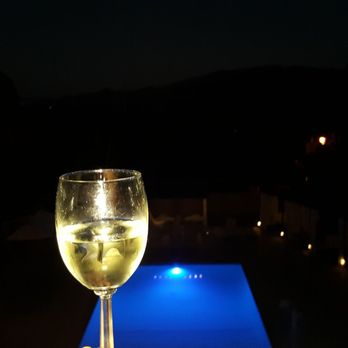 Hotel Corque - Quick view of the pool and my Riesling from Koehler.... pretty dark out no balcony lights - Hotels Near Me - Solvang, California Hotel Corque - Quick view of the pool and my Riesling from Koehler.... pretty dark out no balcony lights - Hotels Near Me - Solvang, California