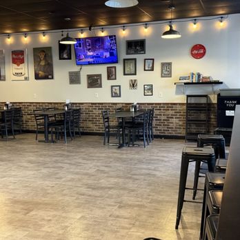 Nico's Pizza - Main dining area has fun illustrated signs - Pizza Near Me - Provo, Utah