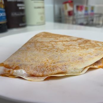 Festa Coffee - a crepe on a white plate - Creperies Near Me - Capitola, California