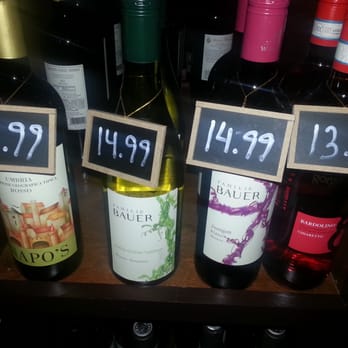 Wine Stop NYC - Smart & neat little chalkboard signs attached to the bottles displaying prices - Beer, Wine & Spirits Near Me - Astoria, New York Wine Stop NYC - Smart & neat little chalkboard signs attached to the bottles displaying prices - Beer, Wine & Spirits Near Me - Astoria, New York