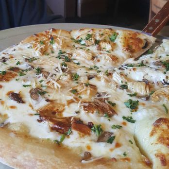 Jack's Place - Alfredo garlic chicken pizza with mushrooms and bacon bits topped with chopped cilantro - Breakfast & Brunch Near Me - Leona Valley, California Jack's Place - Alfredo garlic chicken pizza with mushrooms and bacon bits topped with chopped cilantro - Breakfast & Brunch Near Me - Leona Valley, California