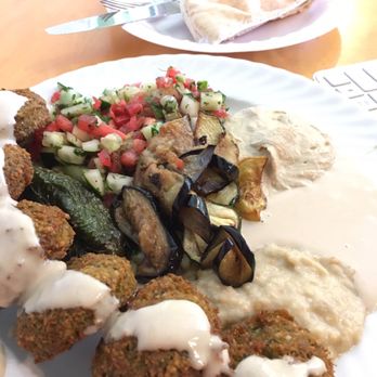 Mana Mana Middle Eastern Restaurant - Falafel, three veggie sides, with babaganush, tahini, hummus sauces. - Mediterranean Near Me - Clearwater, Florida