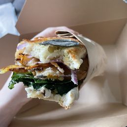 D. Squash Sandwich: Crispy Delicata Squash, maple & orange ricotta, onion, arugula, and lemon on a Sage Stecca