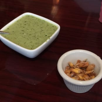 MACA Peruvian Restaurant - They welcome you with Canchita and green spicy sauce. - Peruvian Near Me - Rego Park, New York MACA Peruvian Restaurant - They welcome you with Canchita and green spicy sauce. - Peruvian Near Me - Rego Park, New York