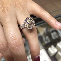 5.50 carat round center plus side diamonds set in platinum. Ideal cut with triple excellent