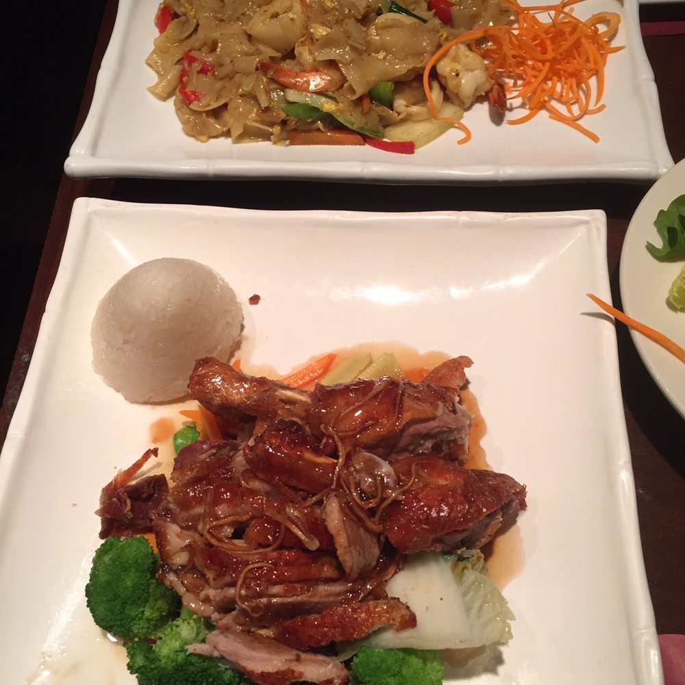 Warwick Thai - Seafood Singaporean noodles (top), crispy duck with sticky rice (bottom) - Thai Near Me - Warwick, New York Warwick Thai - Seafood Singaporean noodles (top), crispy duck with sticky rice (bottom) - Thai Near Me - Warwick, New York