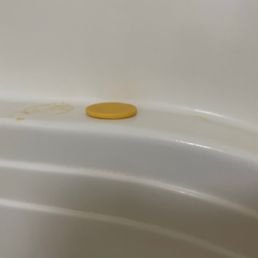 Bar of soap left on tub ledge